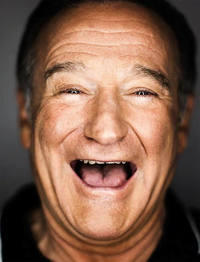 Close-up of a joyful older man smiling widely, capturing the essence of creaking joints and aging with happiness.