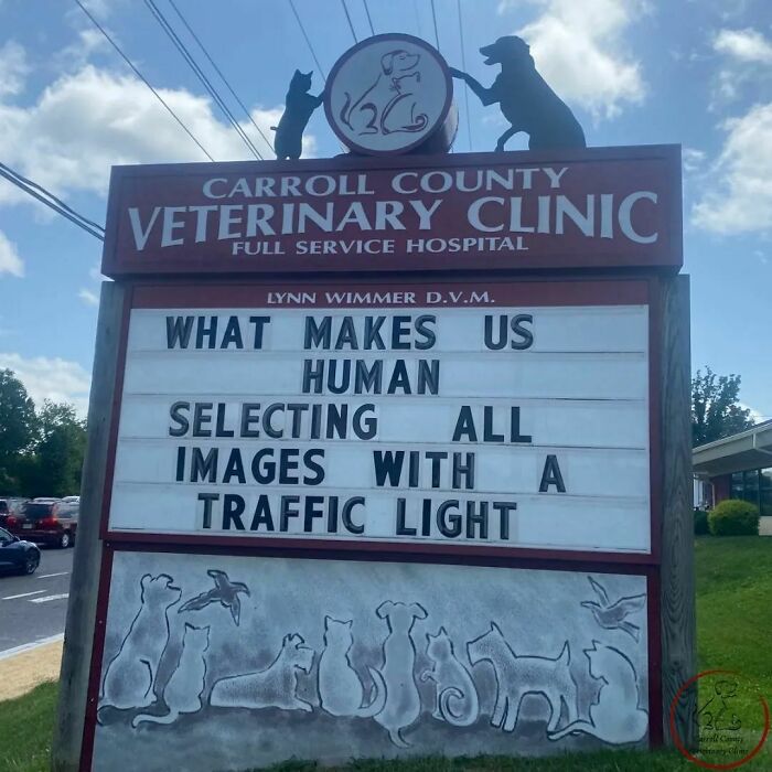 Veterinary clinic sign with a genius joke about selecting images with traffic lights.