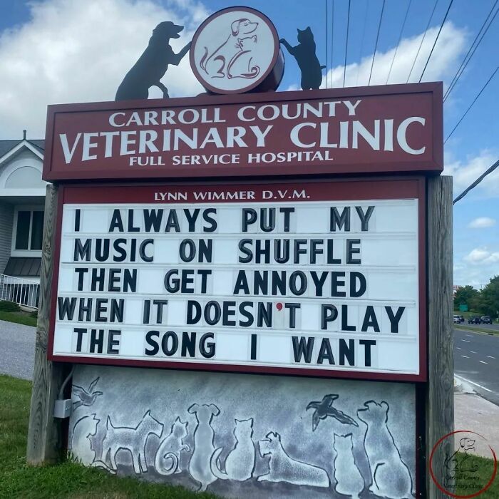 Vet hospital sign displays a funny joke about music shuffle frustration.
