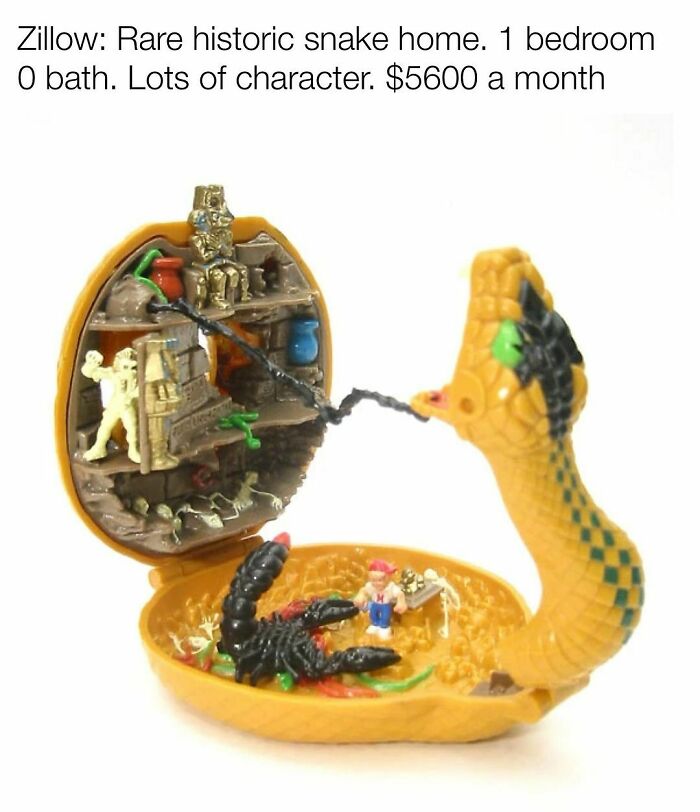 Small snake-shaped toy playset open to show miniature figures inside, evoking nostalgia for Tamagotchis and VHS tapes.
