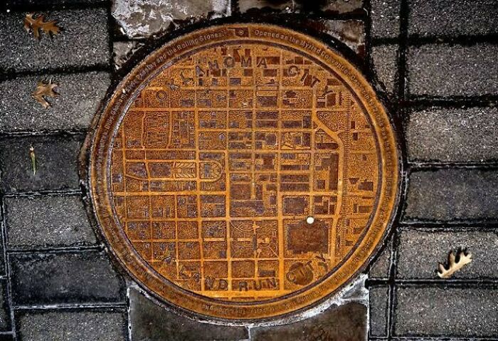 Manhole Covers In Oklahoma Have A City Map On Them With A White Dot Showing Where You Are