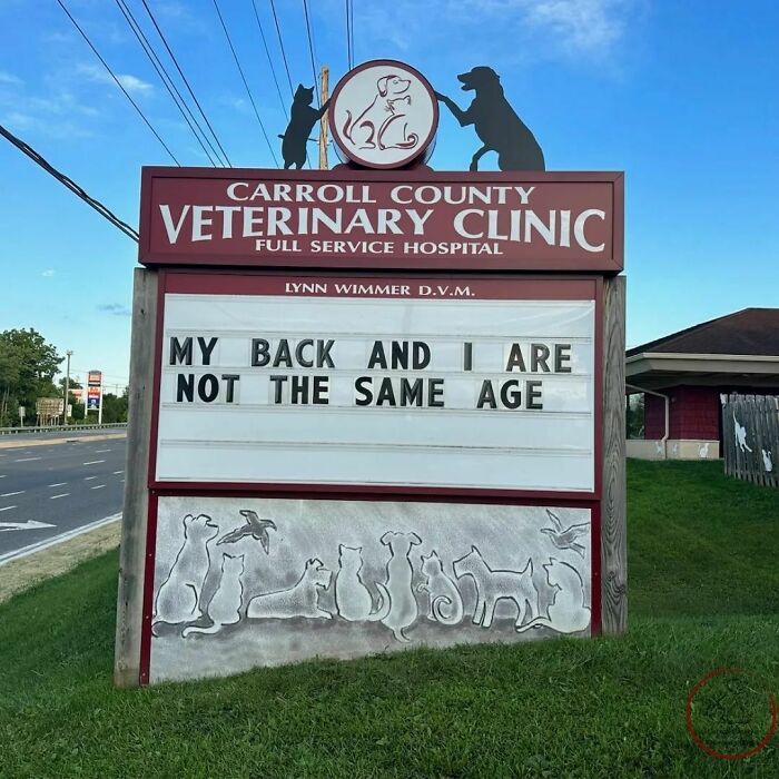 Veterinary hospital sign joke reads, "MY BACK AND I ARE NOT THE SAME AGE" with animal silhouettes.