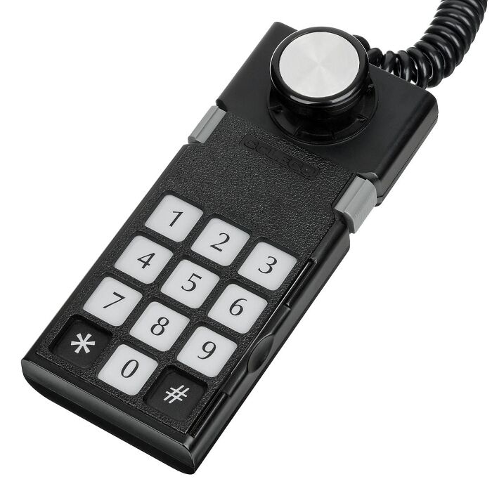 Vintage black phone keypad with rotary dial, a nostalgic item reminding you of creaking joints and old memories.