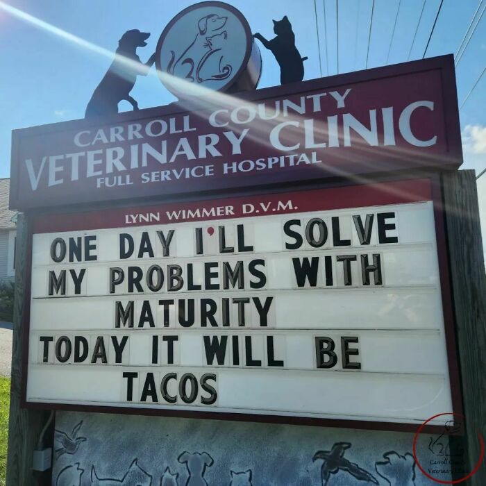 Vet hospital sign joke about solving problems with maturity, but choosing tacos today.