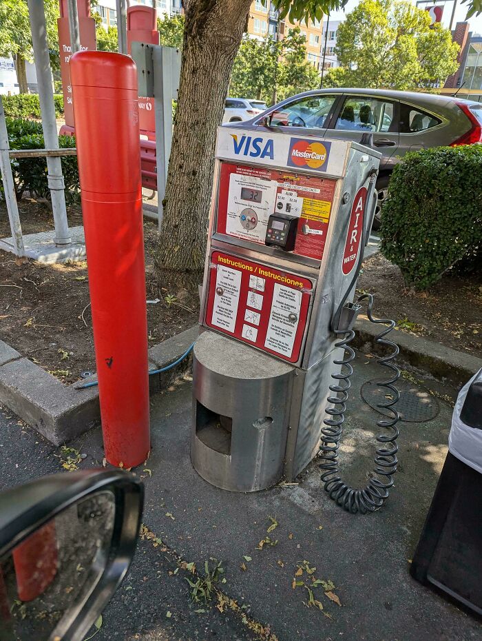 Old-fashioned air pump machine at a gas station, a nostalgic item that may remind you of creaking joints.
