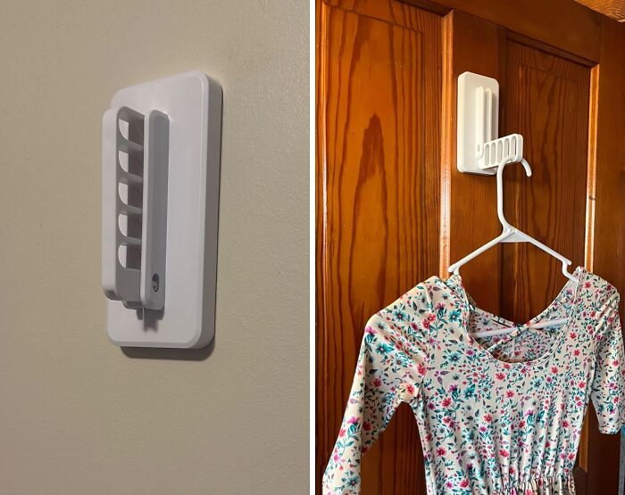 Adjustable wall hook installed on a wooden door holding a floral dress, showcasing dorm storage solutions for awkward nooks.
