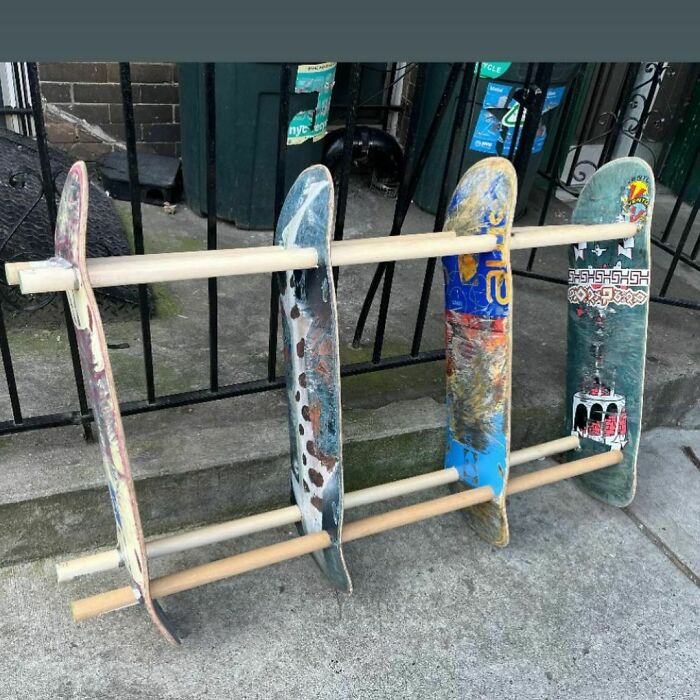 Skateboard decks repurposed as a rack, found on the curb in NYC.