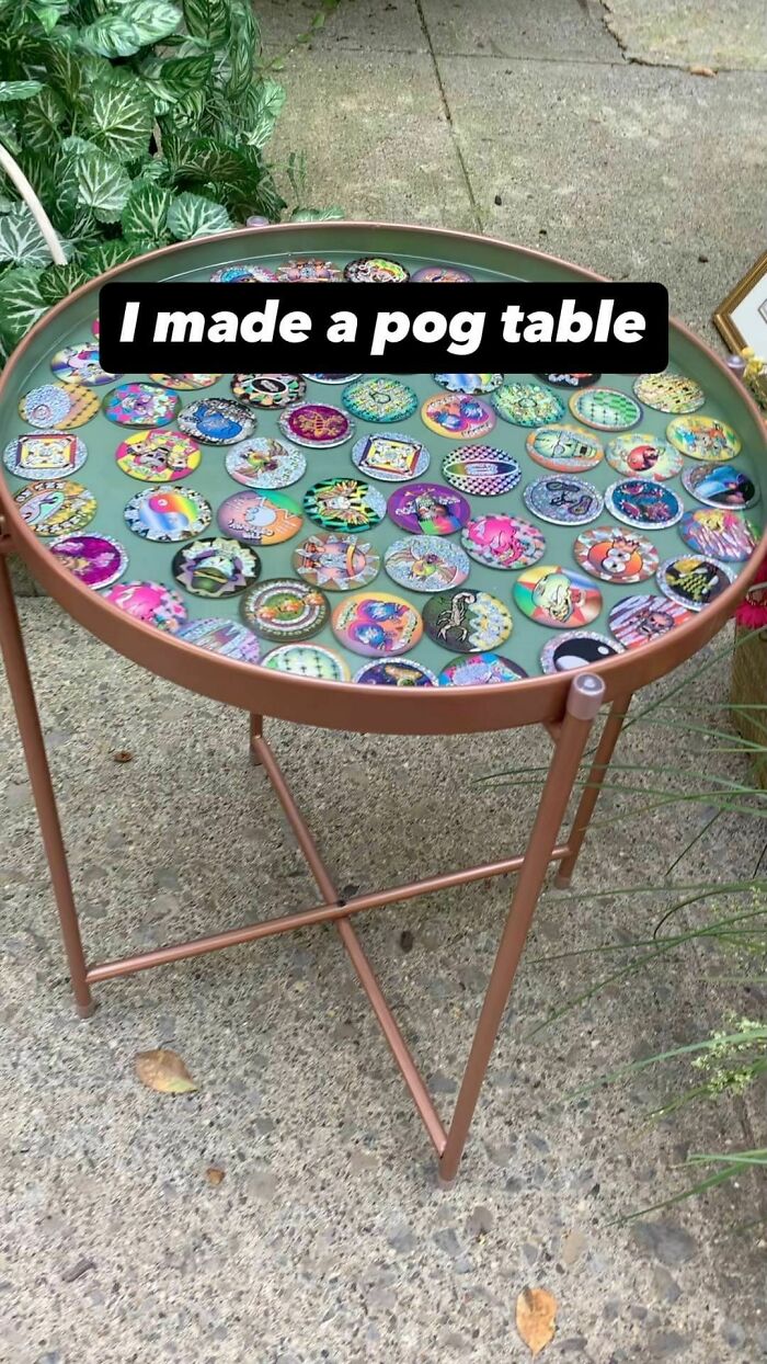 Round table with colorful pogs under a glass top, a nostalgic collectible from childhood memories and retro toys.
