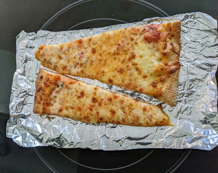 Reheating Pizza On A Flattop Stove Burner Makes The Bottom Crispy Af Without Getting Burnt