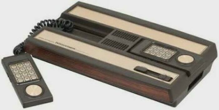 Vintage video game console with wired controller, a nostalgic item that may remind you of creaking joints and older times.