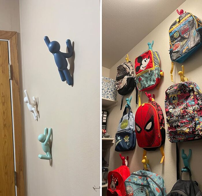 Colorful wall hooks shaped like climbing figures holding various vibrant backpacks, a weirdly wonderful home organization idea.