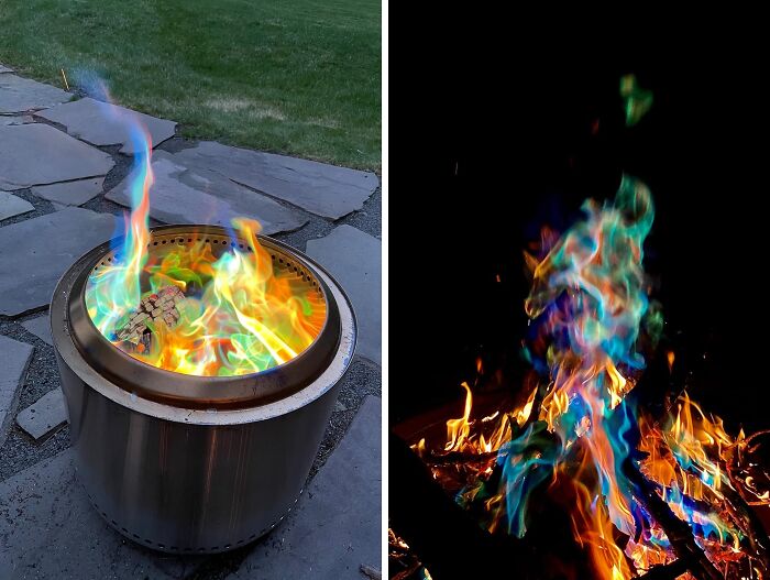 Colorful blue and green flames burning in different fire pits outdoors on a stone patio and dark background