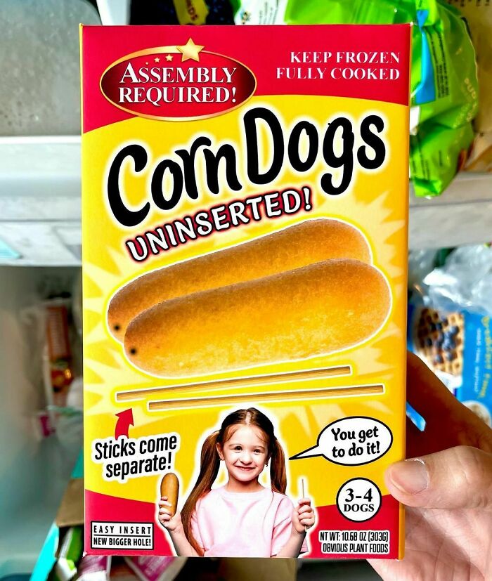 Fake product, "Corn Dogs Uninserted," with separate sticks, by Obvious Plant in grocery store display.