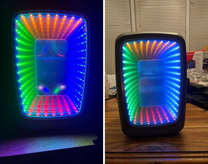 LED infinity mirror with colorful rainbow lights creating a vibrant and weirdly wonderful visual effect indoors.