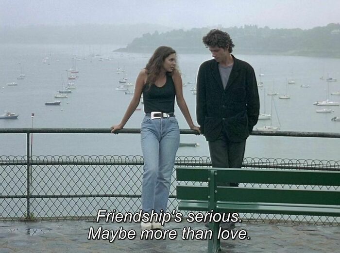 ’90s moment: Two friends having a deep conversation by a sea view, with text overlay about friendship.