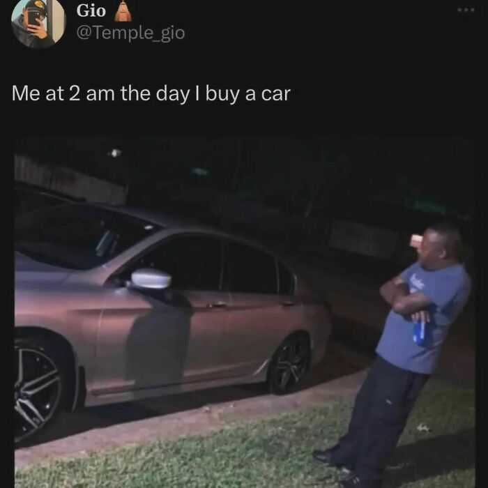Man standing next to a car at night, representing a funny meme capturing excitement and humor after buying a car.