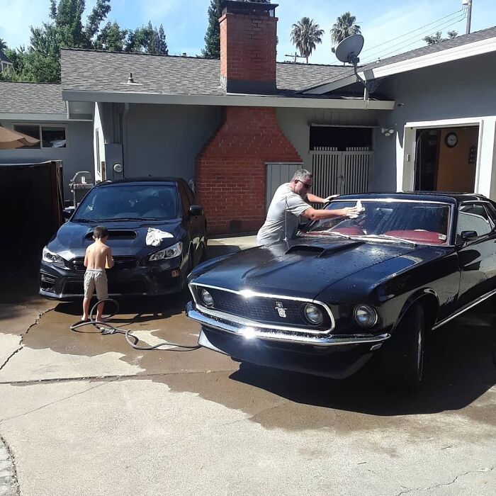 Grandpa And Grandson Cleaning The Babes