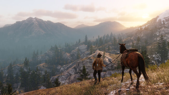 Gamer exploring a mountainous landscape with a horse, capturing the immersive experience of favorite all-time games.