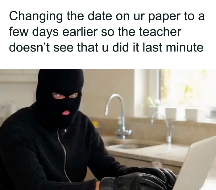 A person in a ski mask at a laptop, humorously editing a paper's date; captures school meme struggles.
