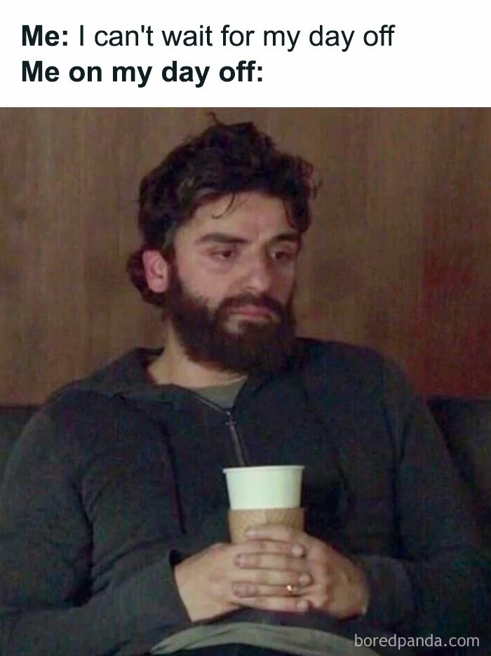 Tired man holding a coffee cup, capturing Sunday meme vibes before facing Monday.