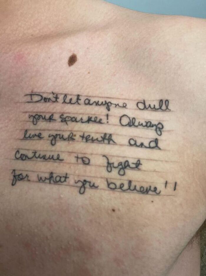 Tattoo of a heartfelt message on a student's chest, reflecting a teacher's impactful words.