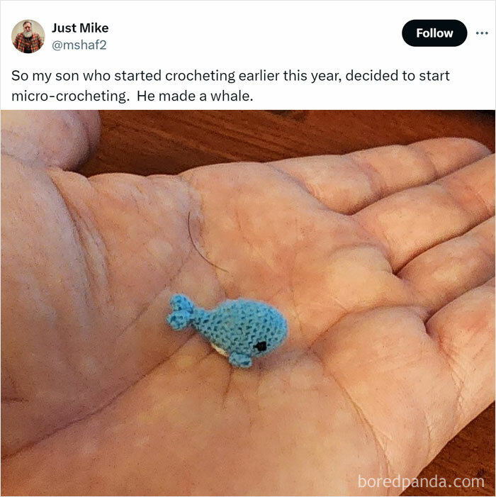 Hand holding a tiny crocheted blue whale, showcasing intricate detail in micro animal memes popular for therapy.