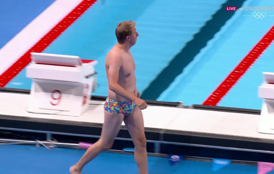 Random Lifeguard Became An Unexpected Hero After Saving The Day By Retrieving Lost Cap In Colorful Trunks