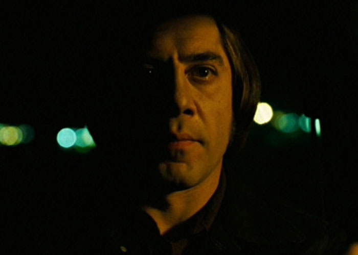Close-up of a man in low light, illustrating one of the surprising film adaptations that outdid their books.