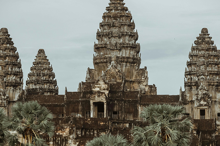 Ancient Angkor Wat temple with palm trees, a memorable place visited that lived up to the hype
