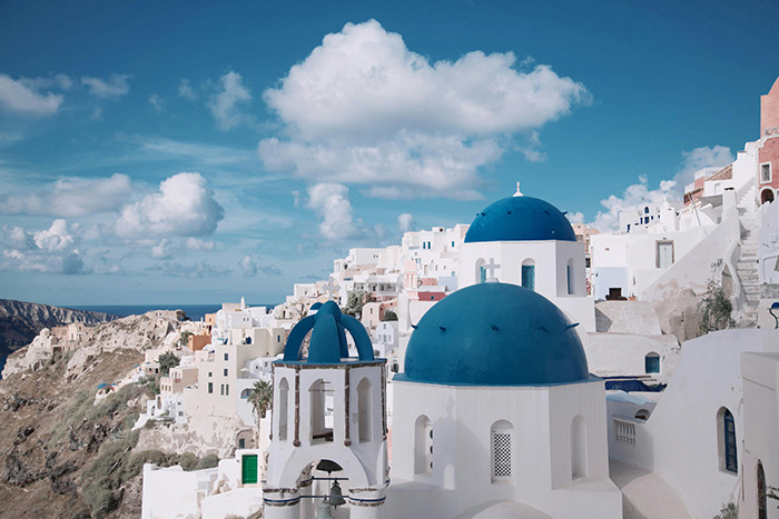 Santorini white buildings and blue-domed churches on cliffside, a place visited that lived up to the hype