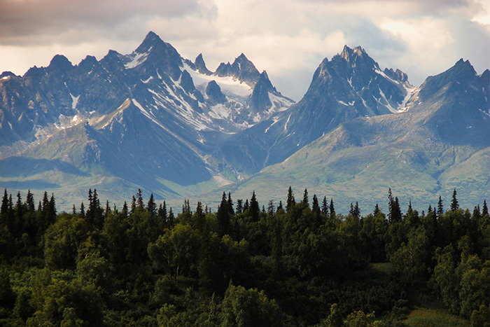 Panoramic jagged mountain range over evergreen forest, a place visited that lived up to the hype