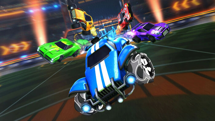 Rocket League cars in mid-air during an intense match, showcasing popular all-time favorite video games gameplay.