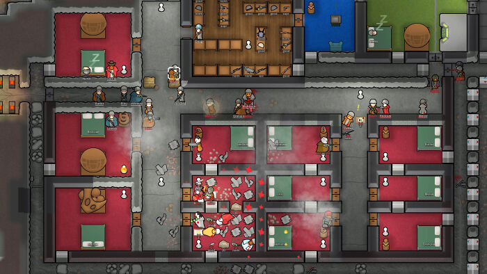 Top-down view of a base in a strategy game showing characters, rooms, and a chaotic scene with smoke and damage.