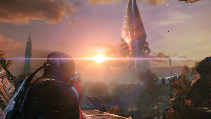 Gamer aiming in a sci-fi shooter game at sunset, showcasing immersive gameplay in popular all-time favorite games.