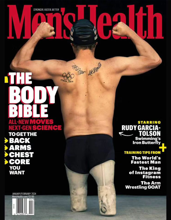 Paralympian with tattoos featured on Men's Health cover, showcasing athletic physique and determination.