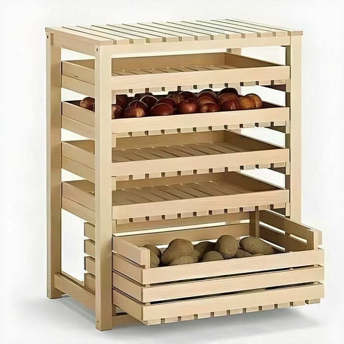 Woodworker project featuring a multi-tier wooden storage rack holding onions and potatoes on a white background.