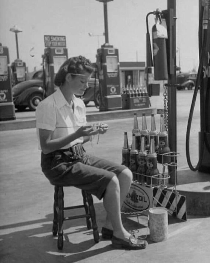 An Attendant At Los Angeles' Gilmore 'Self-Service' Gas Station Took Up Knitting During Slow Periods In 1948