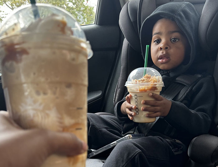 Mom shares son's hilarious expression over drink in car seat.