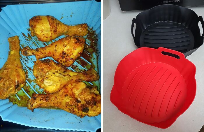 Blue silicone cooking tray with grilled chicken drumsticks and black and red durable silicone grill baskets on a countertop