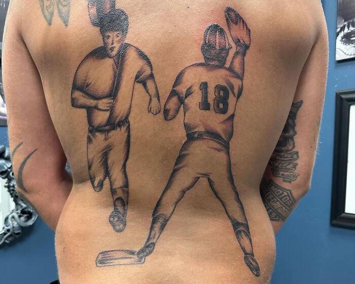 Tattoo of two baseball players on a person's back in a Facebook group featuring questionable tattoos.