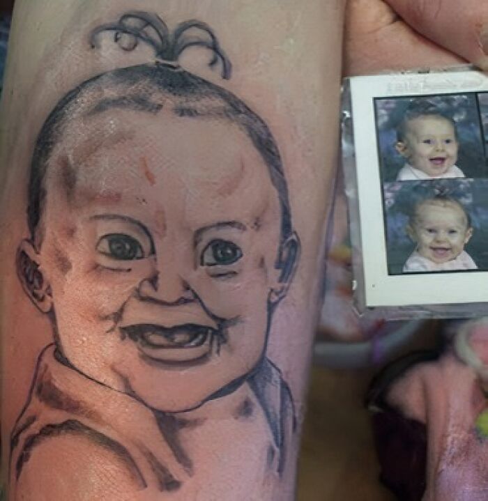 Tattoo of a baby's face with a top knot, beside a reference photo, shared in a Facebook group discussing unusual tattoos.