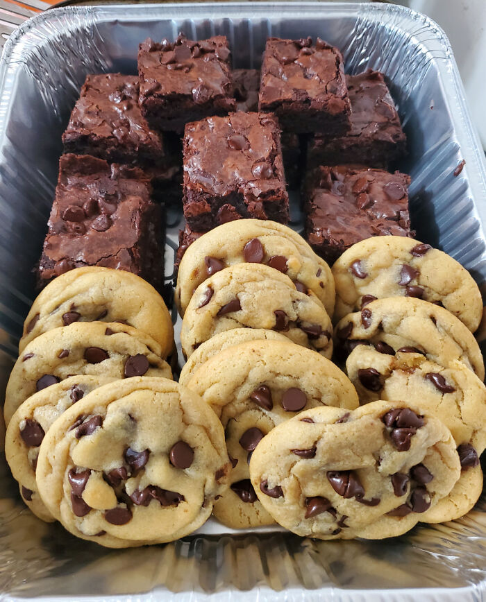 Chocolate chip cookies and brownies arranged in a tray showcasing baking at its finest and delicious treats.