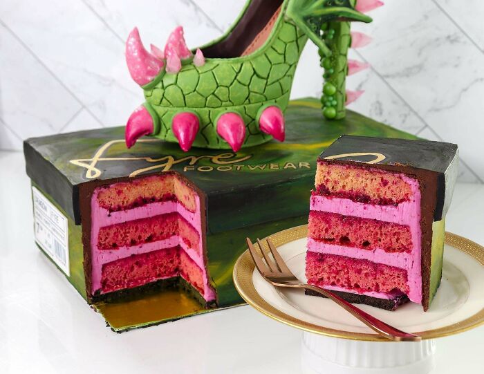Green and pink edible cake shaped like a spiked high heel on a shoebox with a slice of layered pink cake on a plate, baking at its finest.