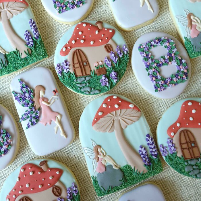 Decorated cookies featuring whimsical fairy, mushroom house, and floral designs showcasing baking at its finest.