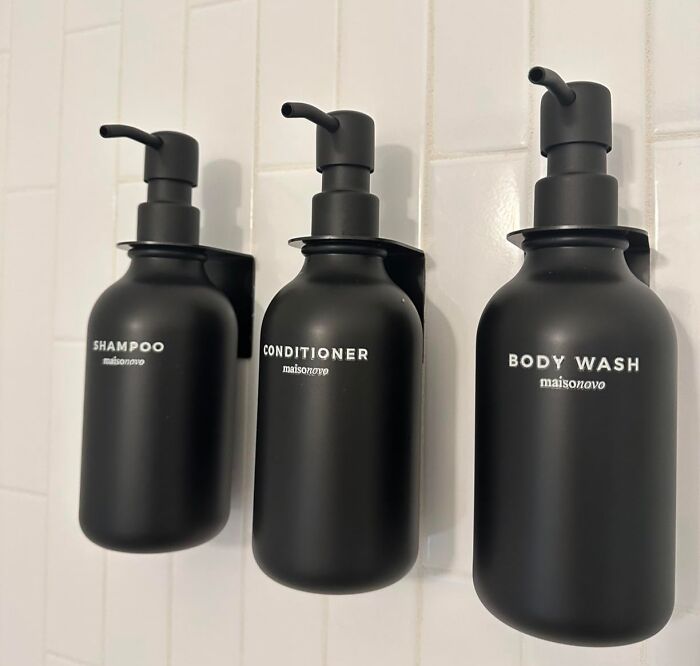 Matte black bathroom dispensers for shampoo, conditioner, and body wash as a home imperfection fix or hide solution.