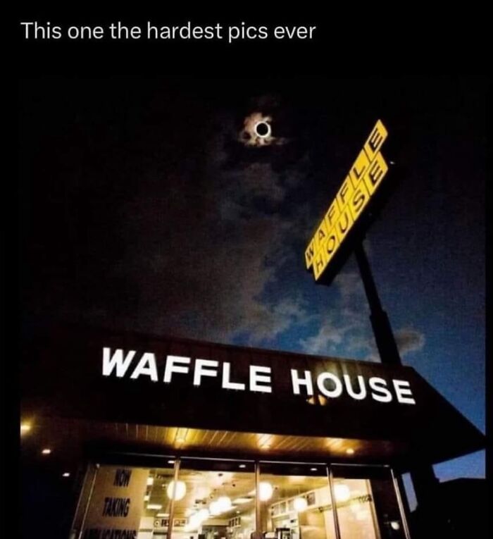 Waffle House at night with a solar eclipse above, showcasing one of the hardest pics ever.