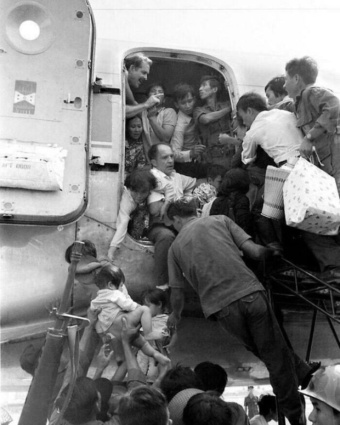 People Struggle To Board A Plane In Nha Trang During The Withdrawal Of Us Troops From South Vietnam. April 1, 1975