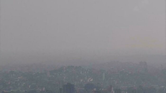 A smoggy urban landscape depicting pollution in a city, highlighting an urban hell environment.
