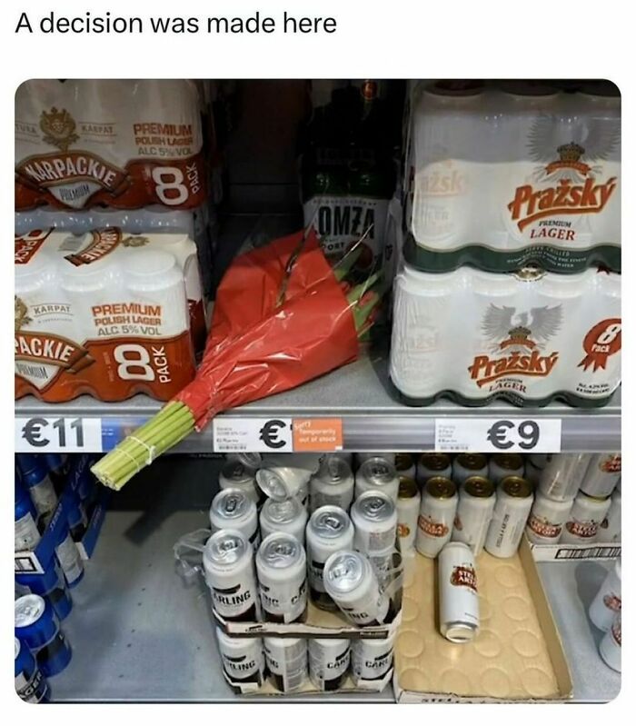 Store shelf displaying beer packs and a bouquet, tagged "A decision was made here," from a meme page.