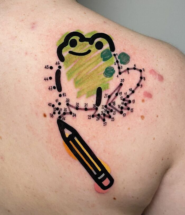 Creative frog tattoo in connect-the-dots style on a person's shoulder, featuring a colorful pencil design.